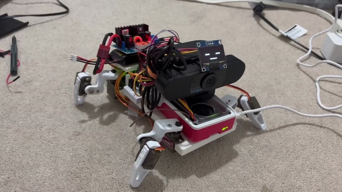 The assembled quadruped robot standing on a carpet.