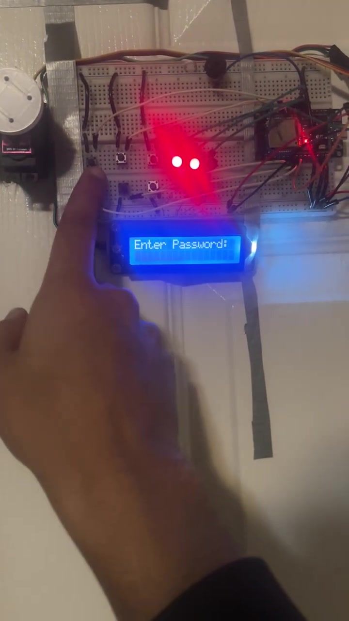 The LCD reading Enter Password with only two red LEDs still lit.