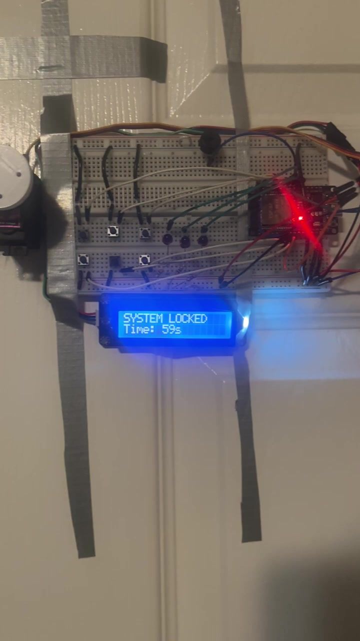 The LCD reading SYSTEM LOCKED above a countdown at 59 seconds, all status LEDs dark.