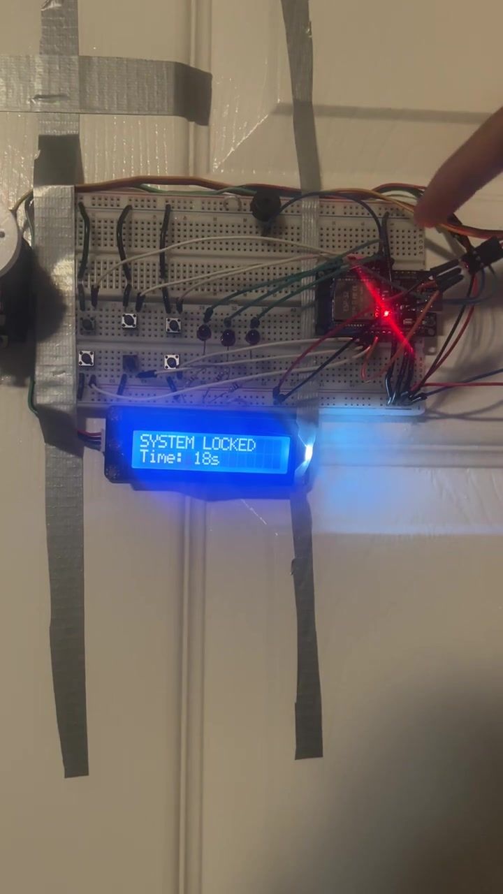 The LCD still reading SYSTEM LOCKED, the timer now showing eighteen seconds.